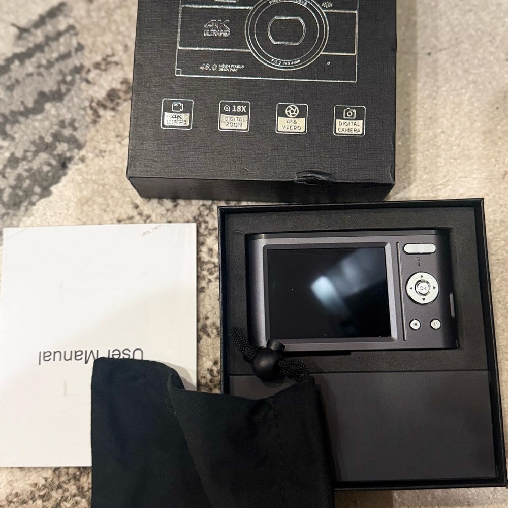Black Digital Camera with Accessories